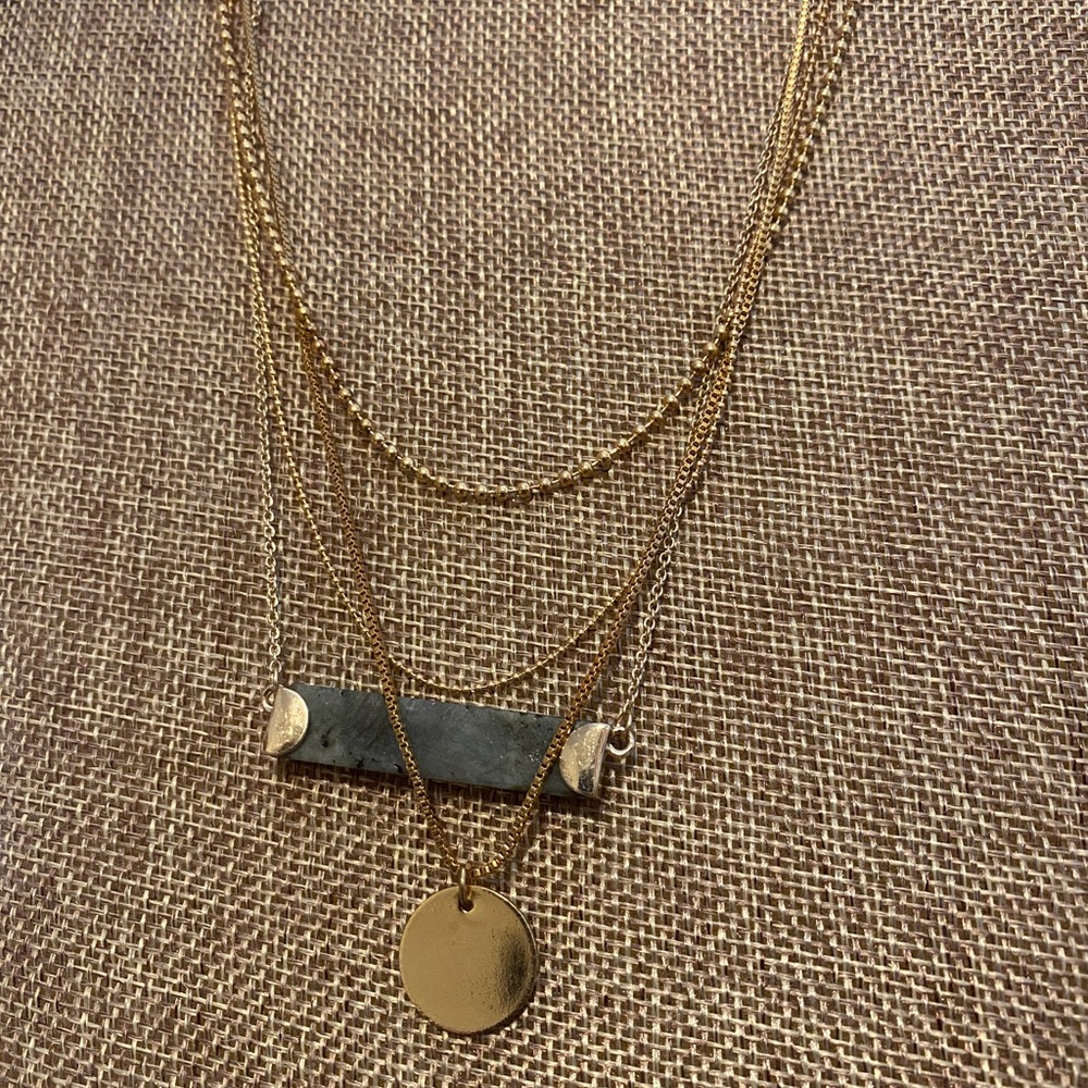 Stack of gold necklaces
